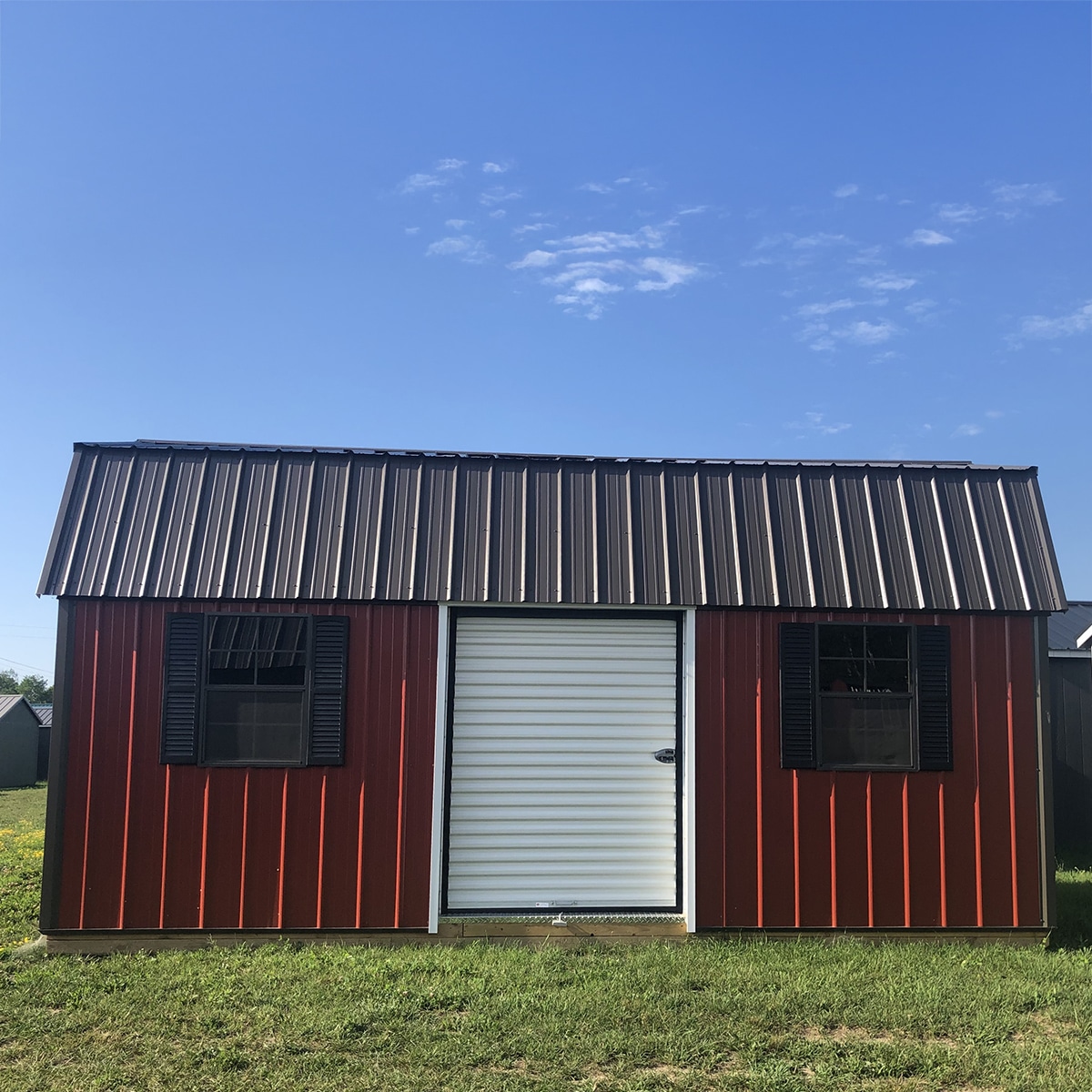 Red and black finish metal lofted garden shed