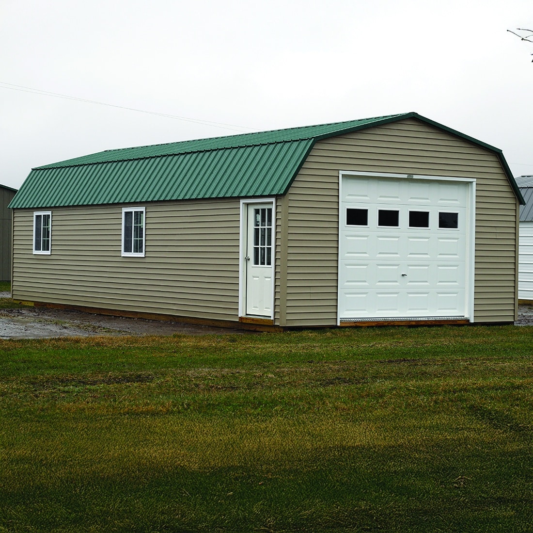 Vinyl sided portable garage with loft